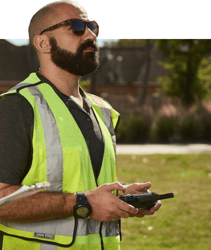 Drone pilot holding a controller