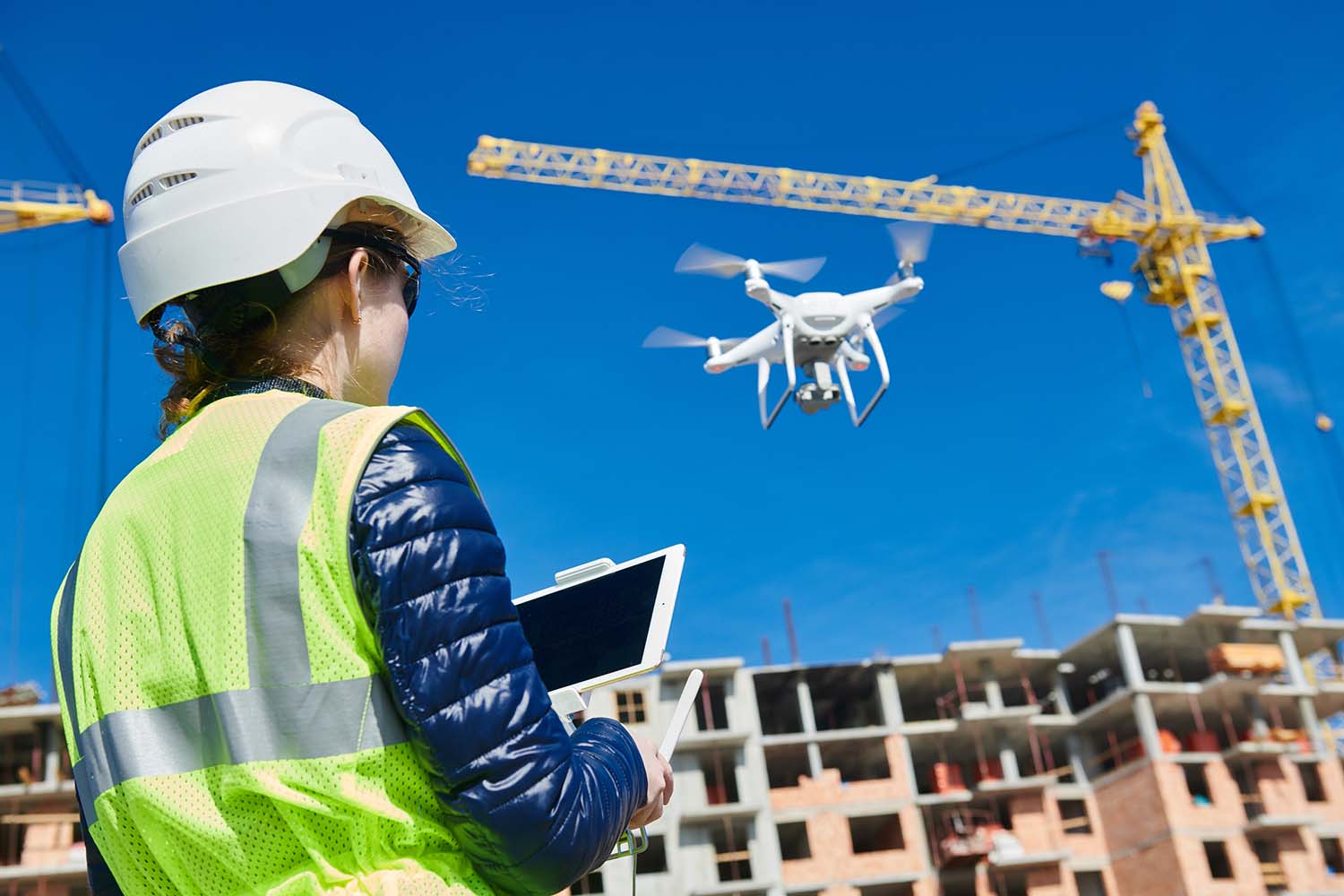 Drone Inspection. Operator Inspecting Construction Building Site